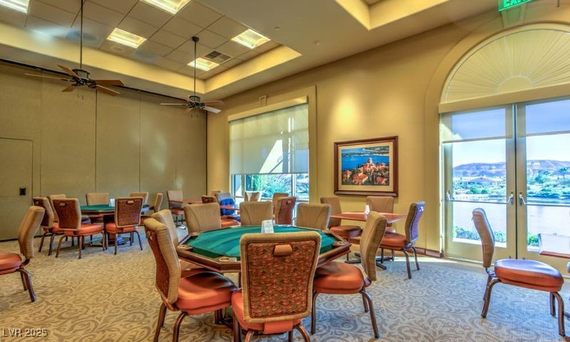 5015 Rivedro Street Las Vegas, NV 89135 - Photo 39 of 63 "A sophisticated Card Room offering a refined setting for card games, complemented by picturesque views of the serene Lake Siena."
