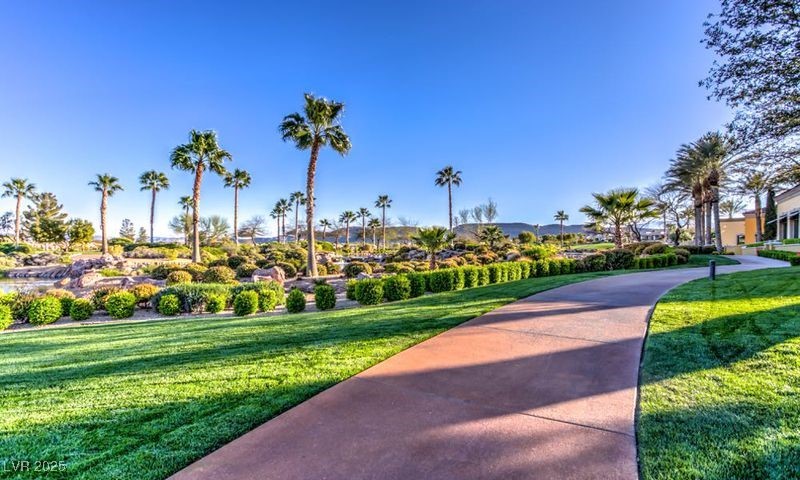 5015 Rivedro Street Las Vegas, NV 89135 - Photo 52 of 63 "Explore up to 10 miles of scenic walking paths winding through the community, perfect for leisurely strolls, staying active, or simply enjoying the beautiful surroundings."