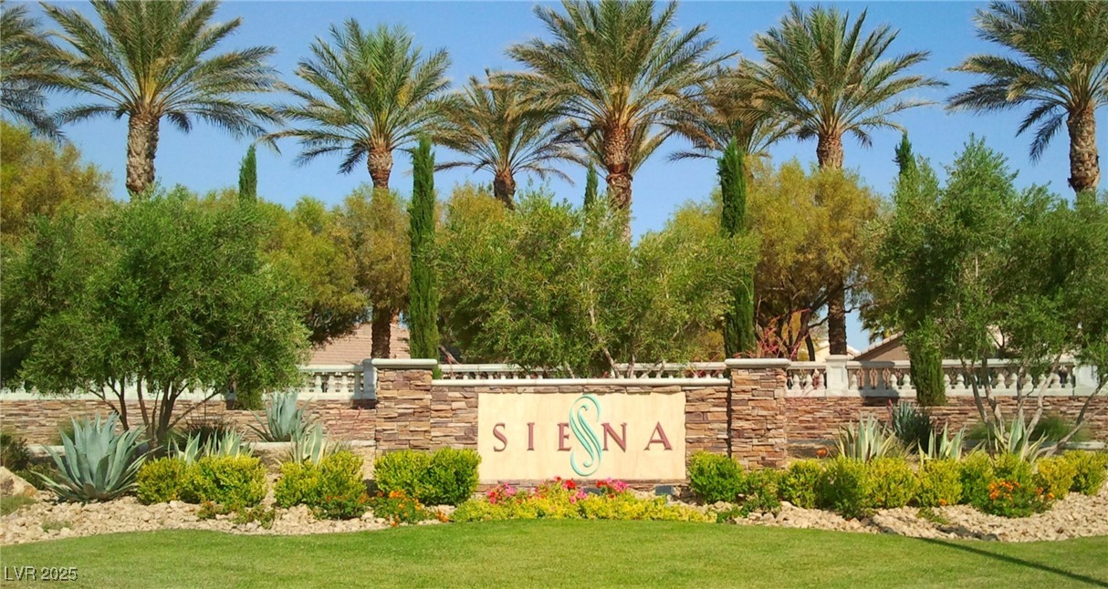 5015 Rivedro Street Las Vegas, NV 89135 - Photo 60 of 63 Community / neighborhood sign with a yard