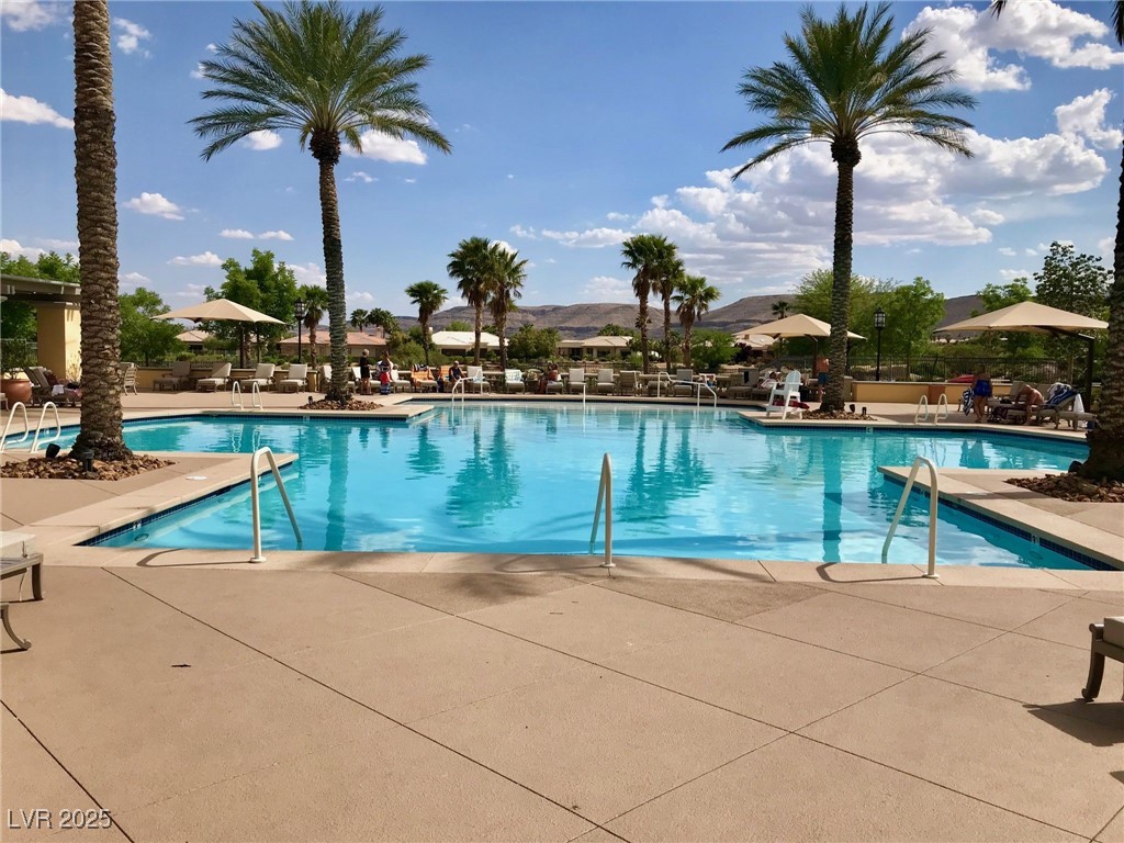 5015 Rivedro Street Las Vegas, NV 89135 - Photo 61 of 63 Community pool featuring a patio area