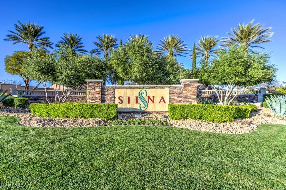 5015 Rivedro Street Las Vegas, NV 89135 - Photo 62 of 63 Community / neighborhood sign with a yard