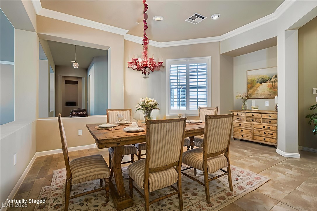 5015 Rivedro Street Las Vegas, NV 89135 - Photo 7 of 63 This inviting kitchen dining space, viewed from the kitchen, offers ample room for everyday meals or formal gatherings. To the right, a recessed niche provides the perfect spot for a China cabinet—or can be reimagined as a built-in computer workstation, blending style with function.