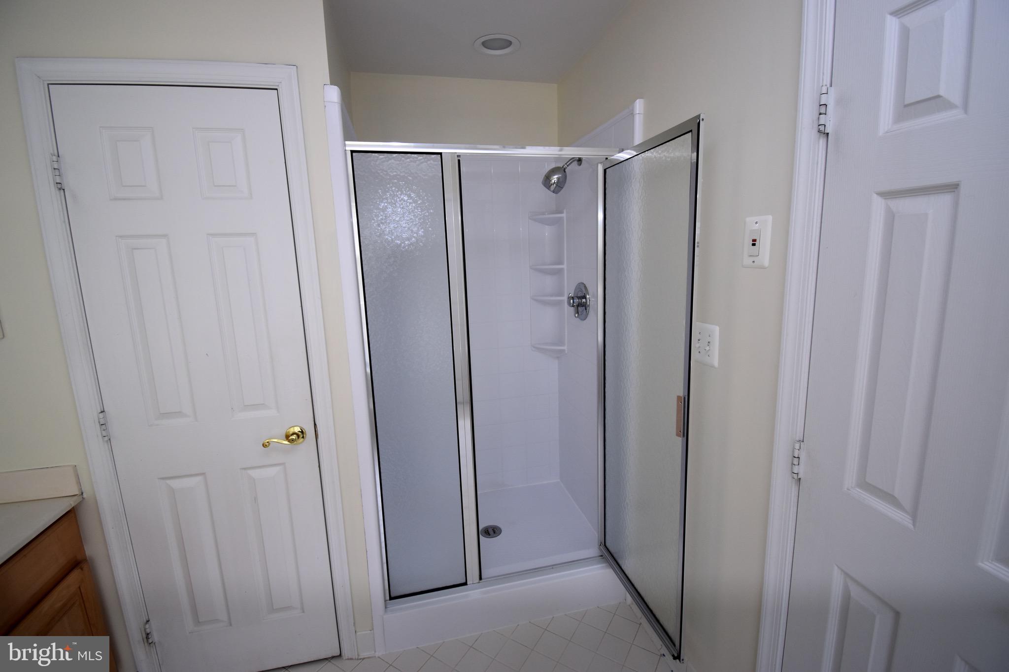 13571 Cedar Run Lane Herndon, VA 20171 - Photo 24 of 33 a bathroom with a shower and a sink