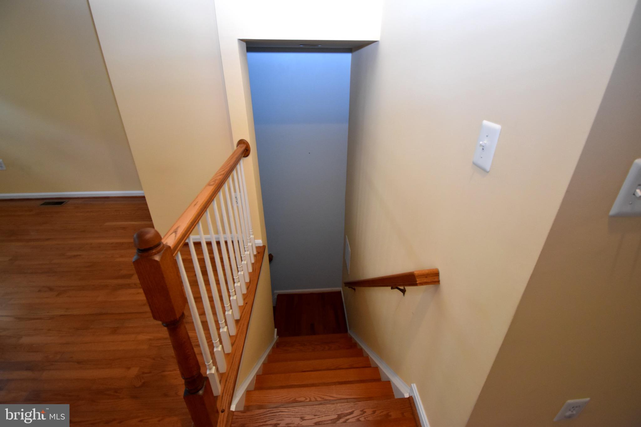 13571 Cedar Run Lane Herndon, VA 20171 - Photo 29 of 33 a view of a hallway with wooden floor and staircase