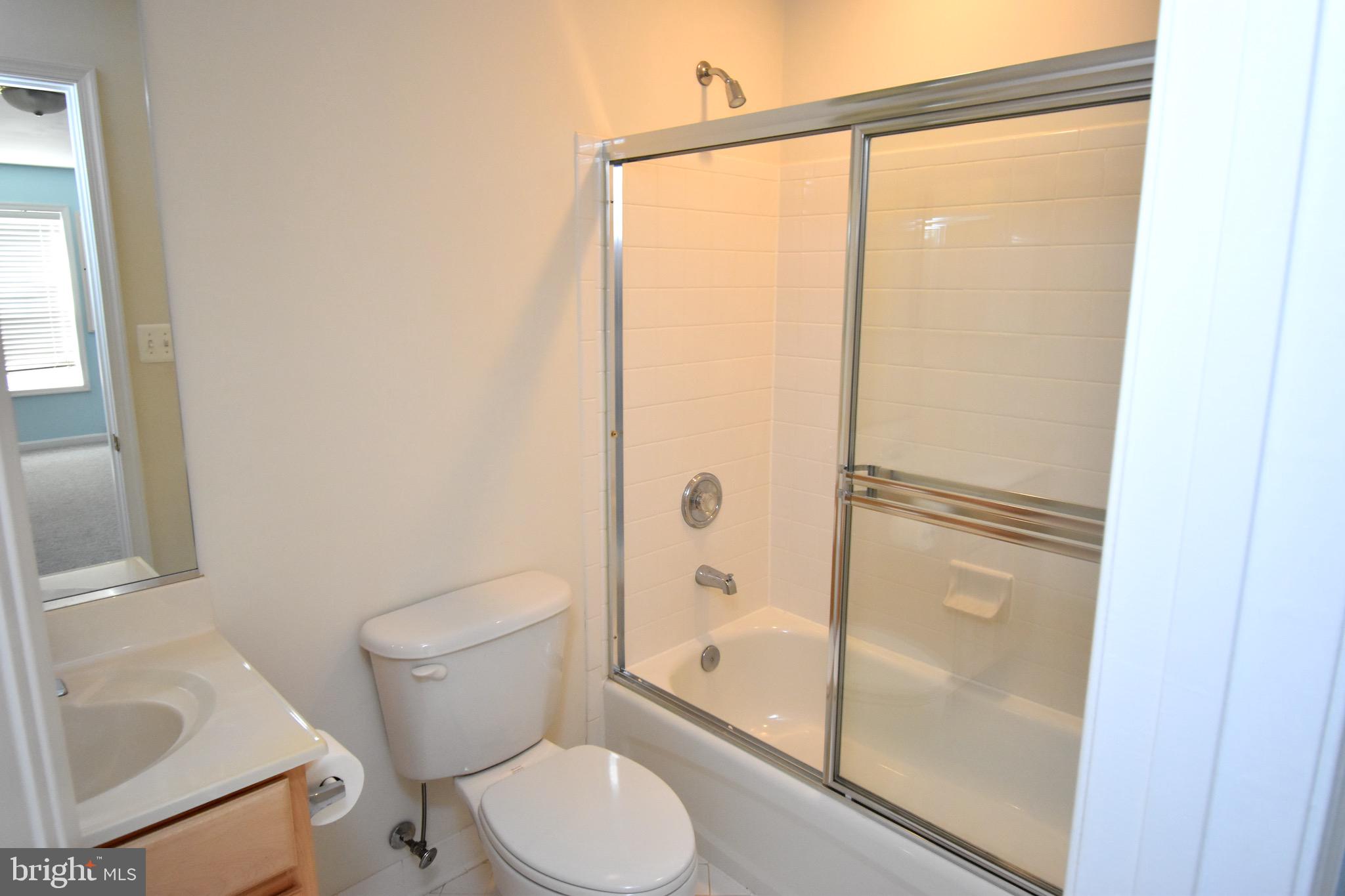 13571 Cedar Run Lane Herndon, VA 20171 - Photo 31 of 33 a bathroom with a granite countertop bathtub shower sink vanity and toilet