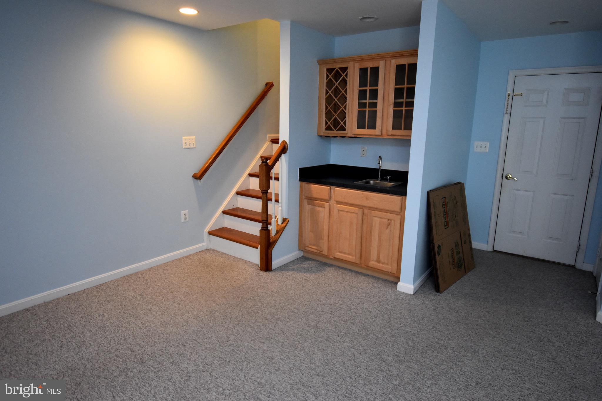13571 Cedar Run Lane Herndon, VA 20171 - Photo 32 of 33 a view of an empty room with stairs and furniture