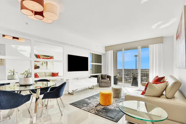 a living room with furniture and a flat screen tv
