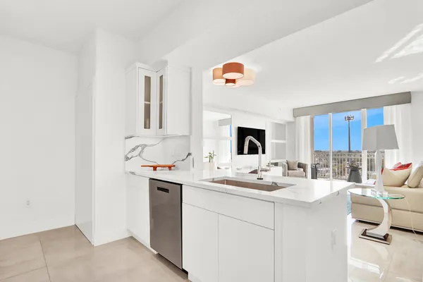 a kitchen with a sink cabinets and window