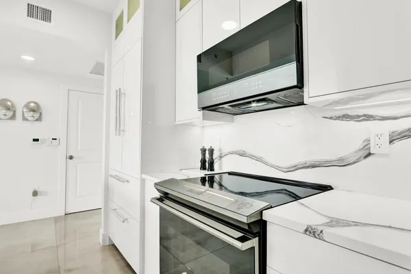 a kitchen with a stove and a microwave