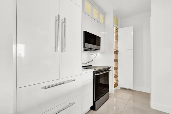 a kitchen with a stove and a microwave