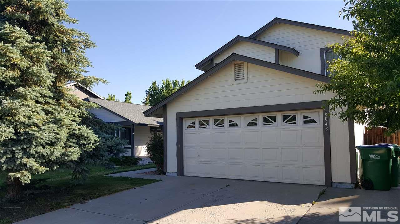 6043 Warm River Road Reno, NV 89523 - Photo 1 of 1 a view of a house with a yard and garage