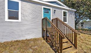 24116 Armadillo Road Astor, FL 32102 - Photo 6 of 28 a view of a house with backyard and deck