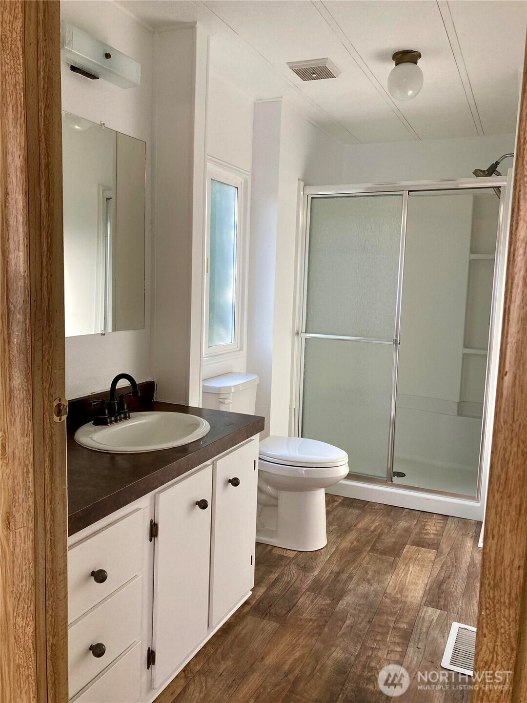 1841 Trosper Road Southwest, Unit 32 Tumwater, WA 98512 - Photo 12 of 13 a bathroom with a sink a toilet and shower