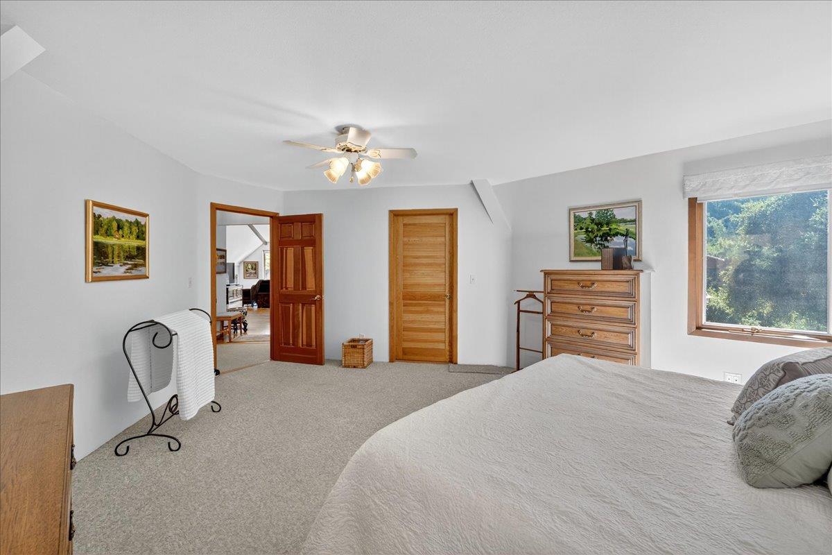 5224 Twin Falls Road Morgan Hill, CA 95037 - Photo 45 of 111 a bedroom with a bed and a chandelier