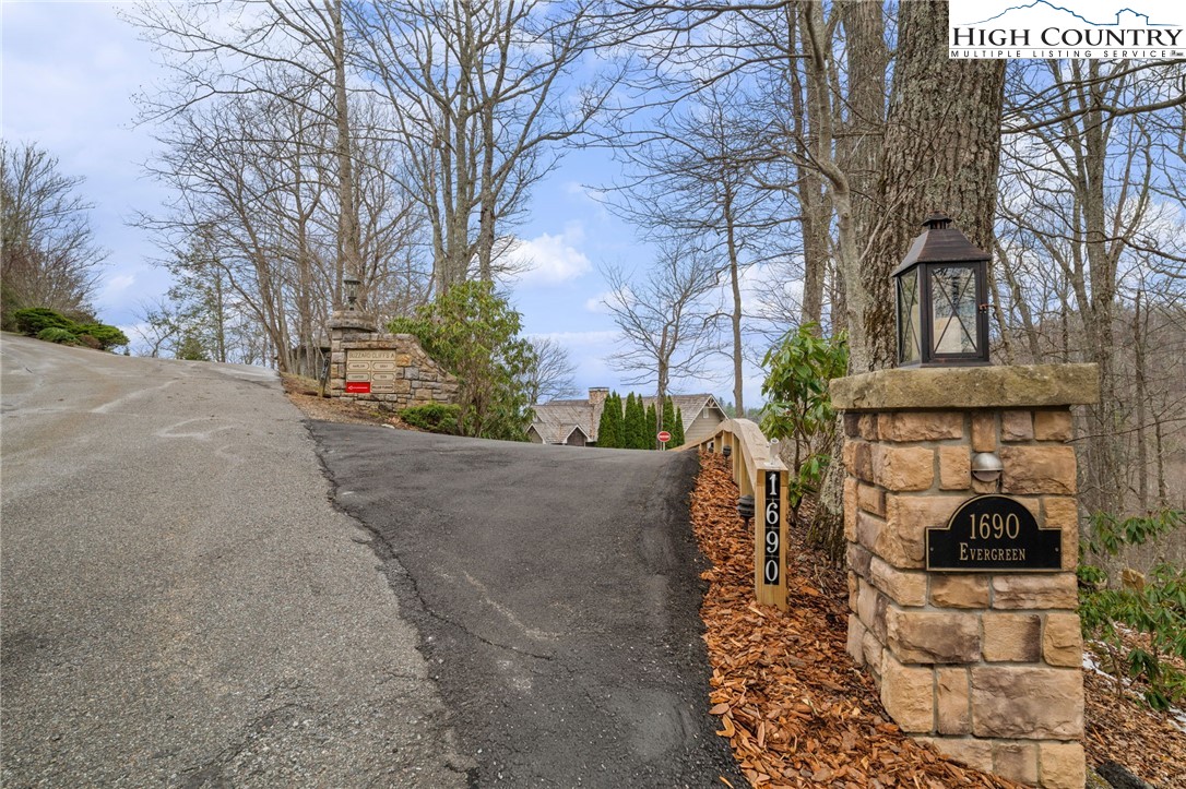 1690 Evergreen Drive Boone, NC 28607 - Photo 2 of 47 a view of a patio with table and chairs and potted plants