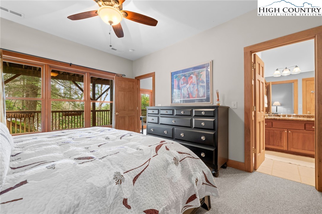 1690 Evergreen Drive Boone, NC 28607 - Photo 26 of 47 a bedroom with a bed and a large window