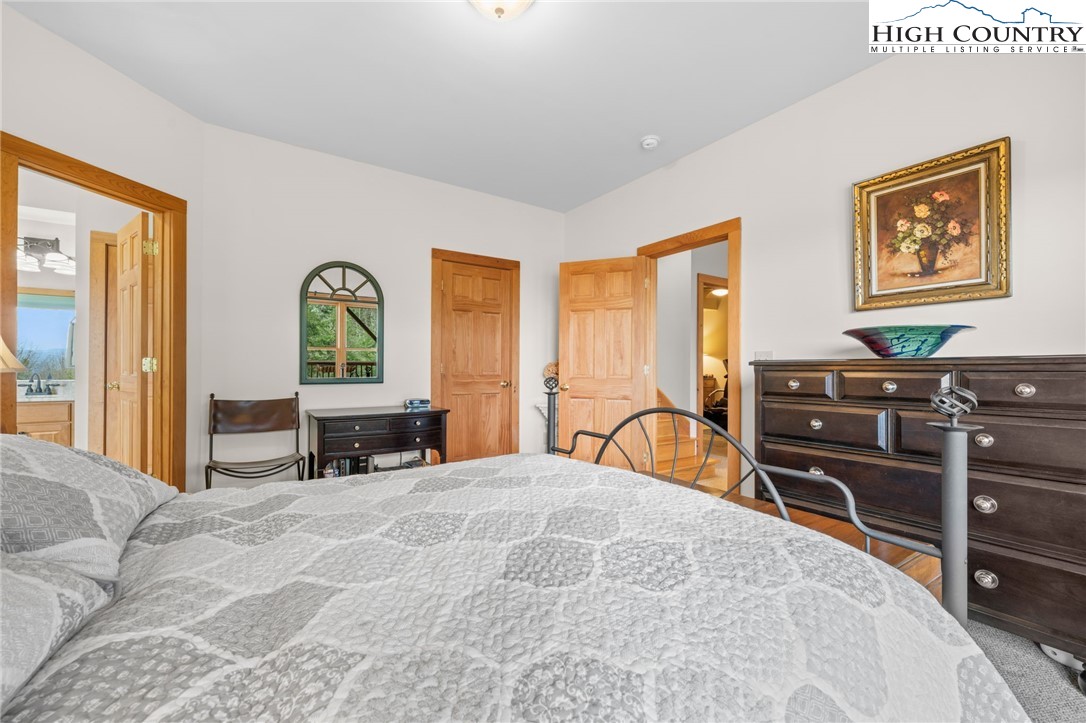 1690 Evergreen Drive Boone, NC 28607 - Photo 29 of 47 a bedroom with a bed and furniture