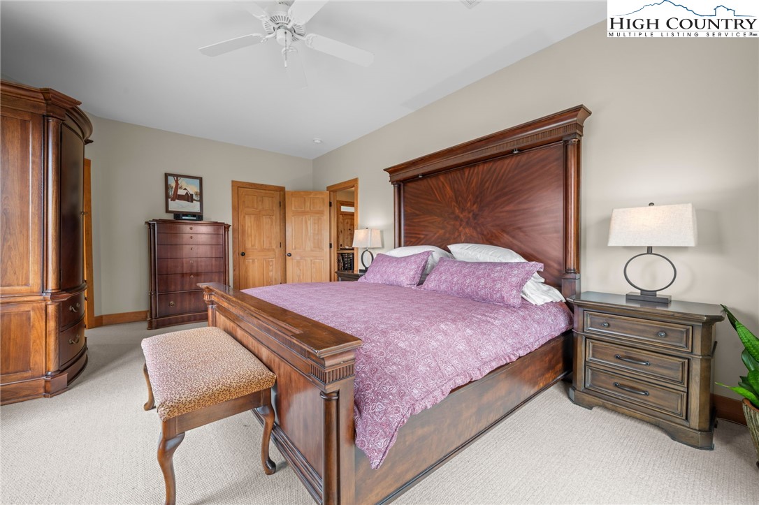 1690 Evergreen Drive Boone, NC 28607 - Photo 34 of 47 a bedroom with a bed and a dresser