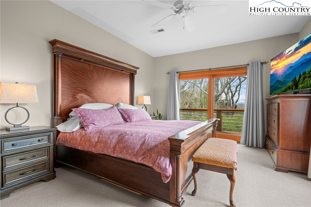 1690 Evergreen Drive Boone, NC 28607 - Photo 35 of 47 a bedroom with a bed and large window
