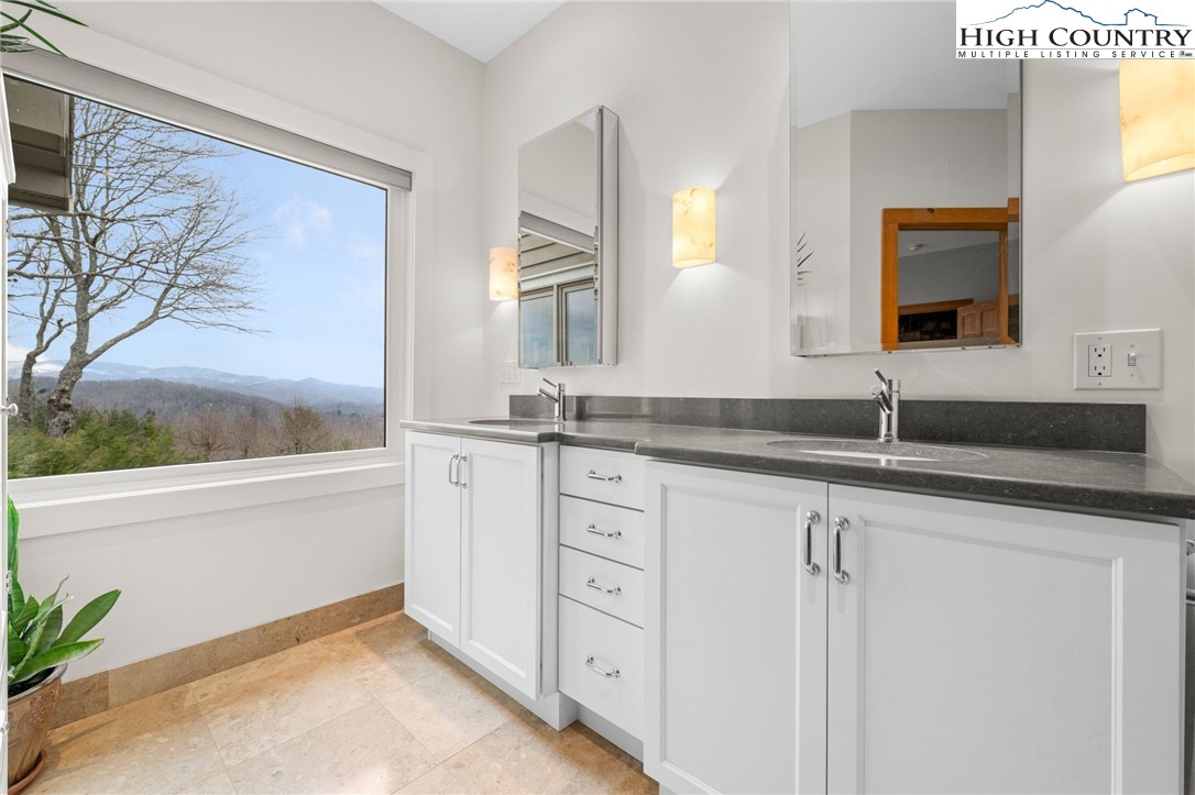 1690 Evergreen Drive Boone, NC 28607 - Photo 36 of 47 a bathroom with a sink and a mirror