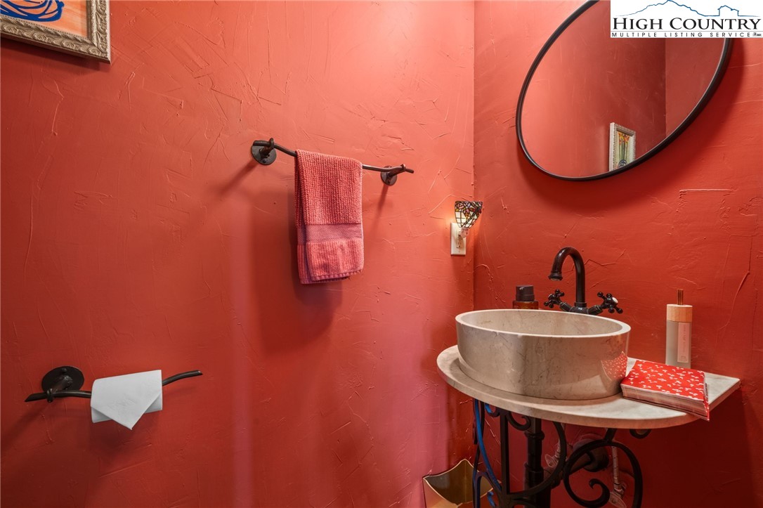 1690 Evergreen Drive Boone, NC 28607 - Photo 6 of 47 a bathroom with a sink and mirror
