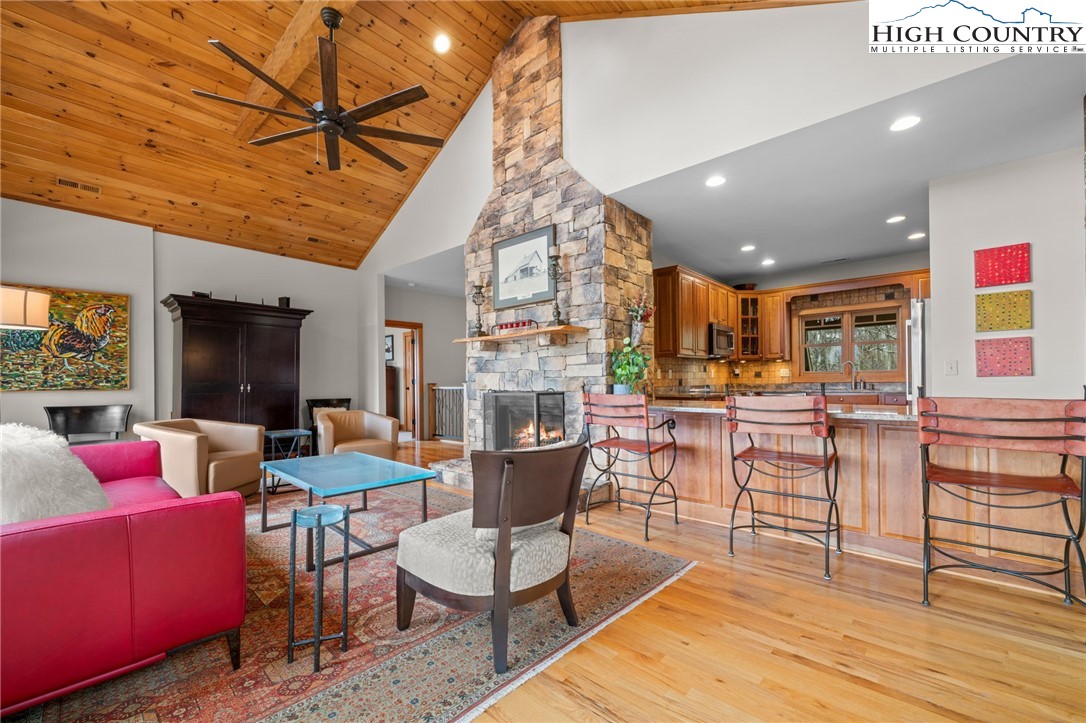1690 Evergreen Drive Boone, NC 28607 - Photo 10 of 47 a living room with furniture a wooden floor and kitchen view
