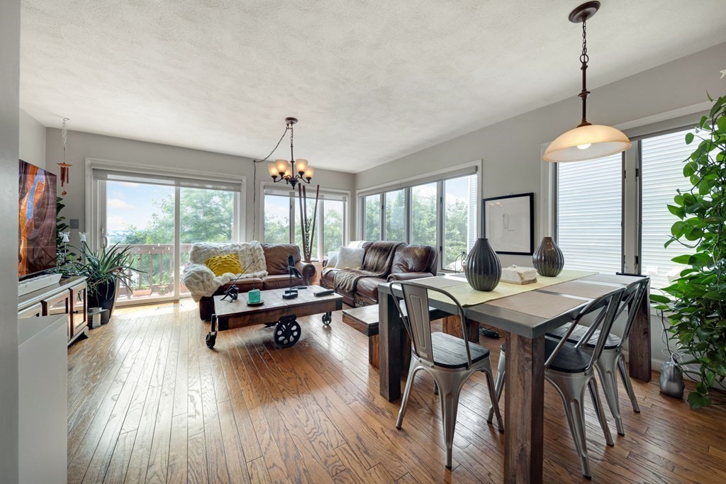 80 Ridge Road, Unit 80 Revere, MA 02151 - Photo 1 of 41 a living room with furniture dining table and a large window