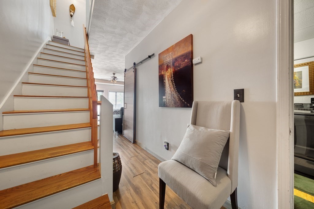 80 Ridge Road, Unit 80 Revere, MA 02151 - Photo 12 of 41 a view of entryway and hall with wooden floor