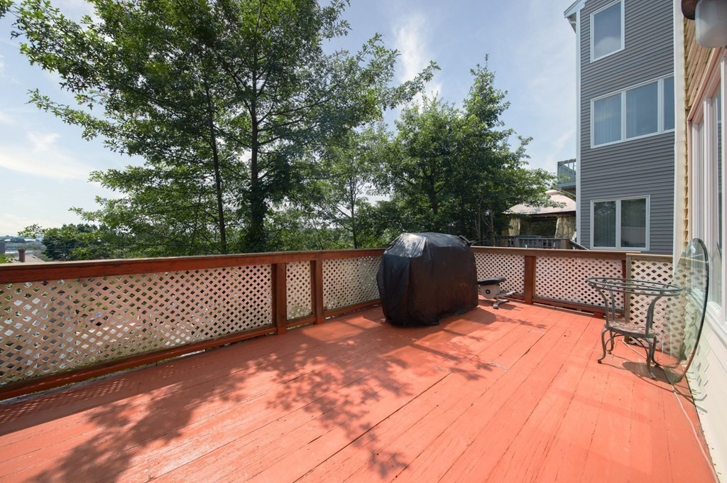 80 Ridge Road, Unit 80 Revere, MA 02151 - Photo 17 of 41 a balcony with a table and chairs