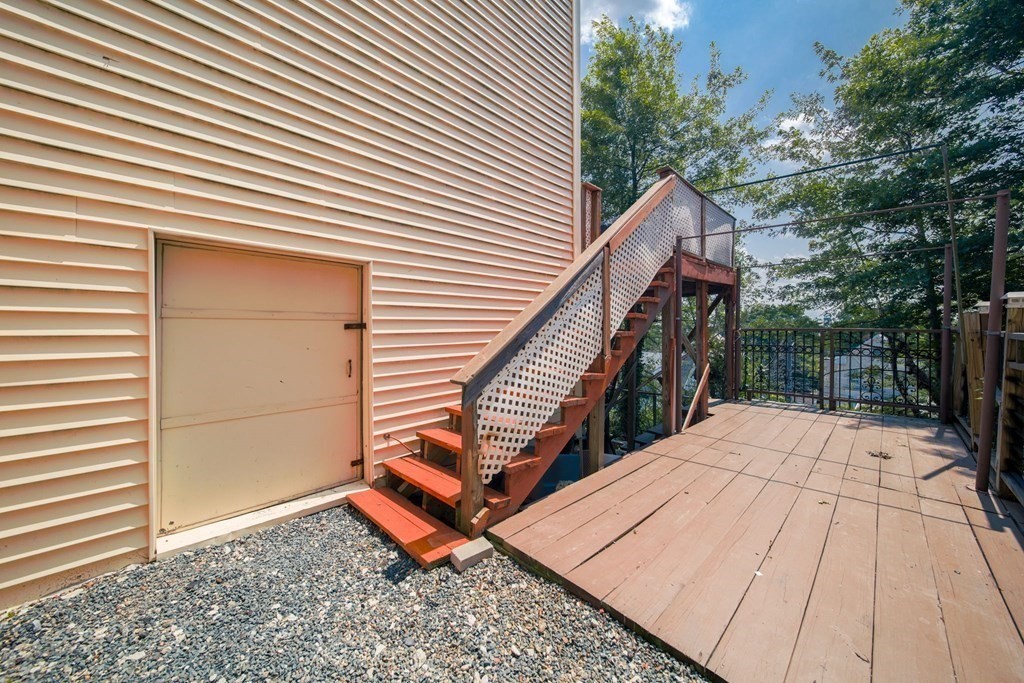 80 Ridge Road, Unit 80 Revere, MA 02151 - Photo 19 of 41 a view of backyard with a deck and wooden floor