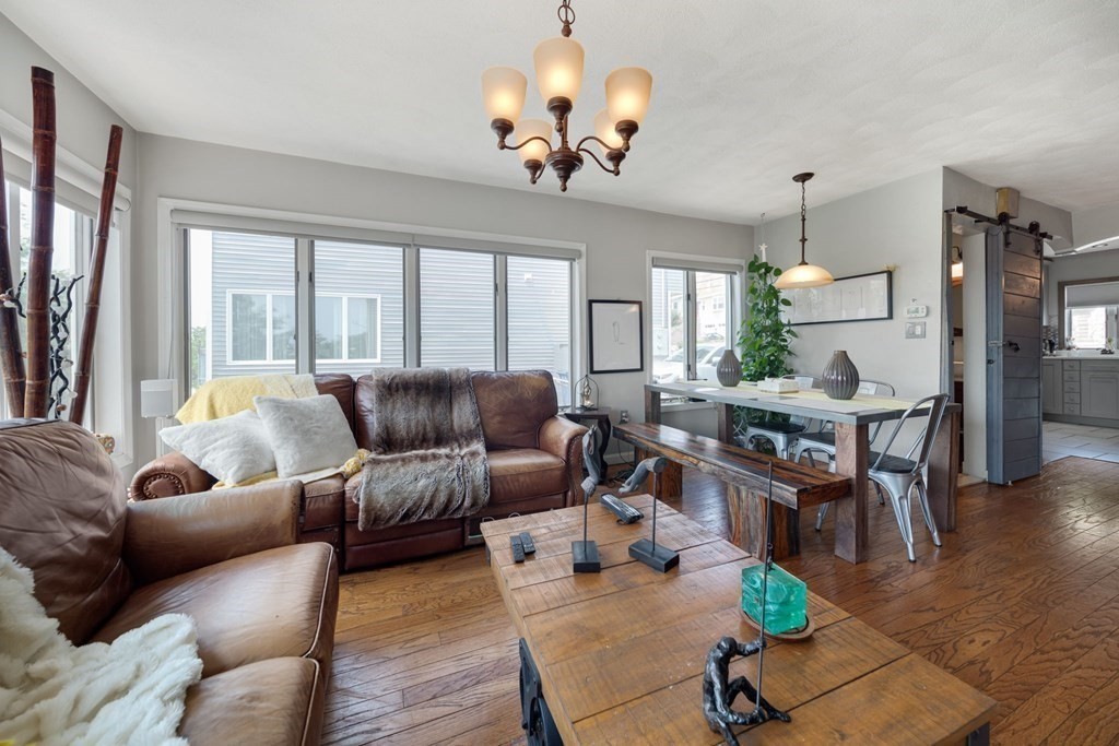 80 Ridge Road, Unit 80 Revere, MA 02151 - Photo 2 of 41 a living room with furniture chandelier and a chandelier