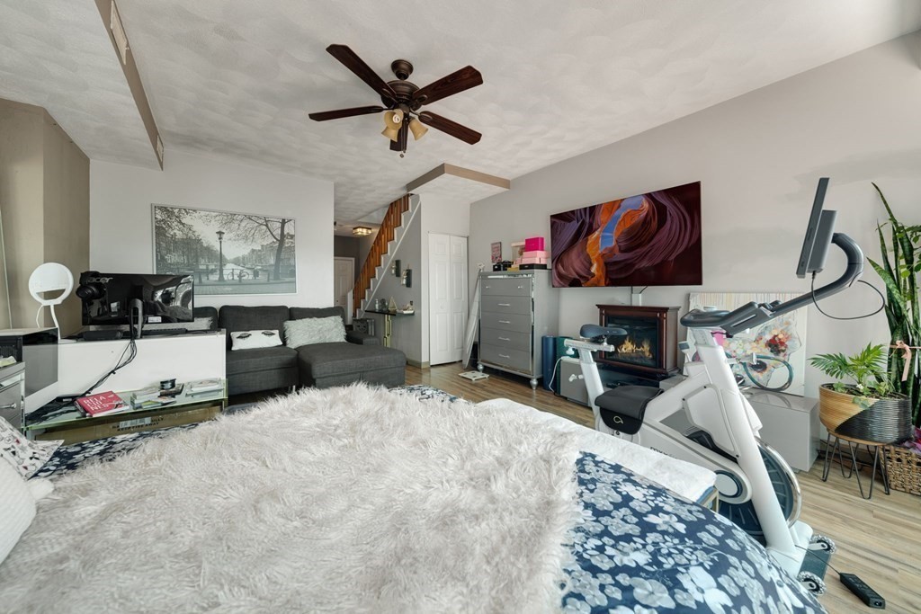 80 Ridge Road, Unit 80 Revere, MA 02151 - Photo 21 of 41 a bed room with a bed and a flat screen tv