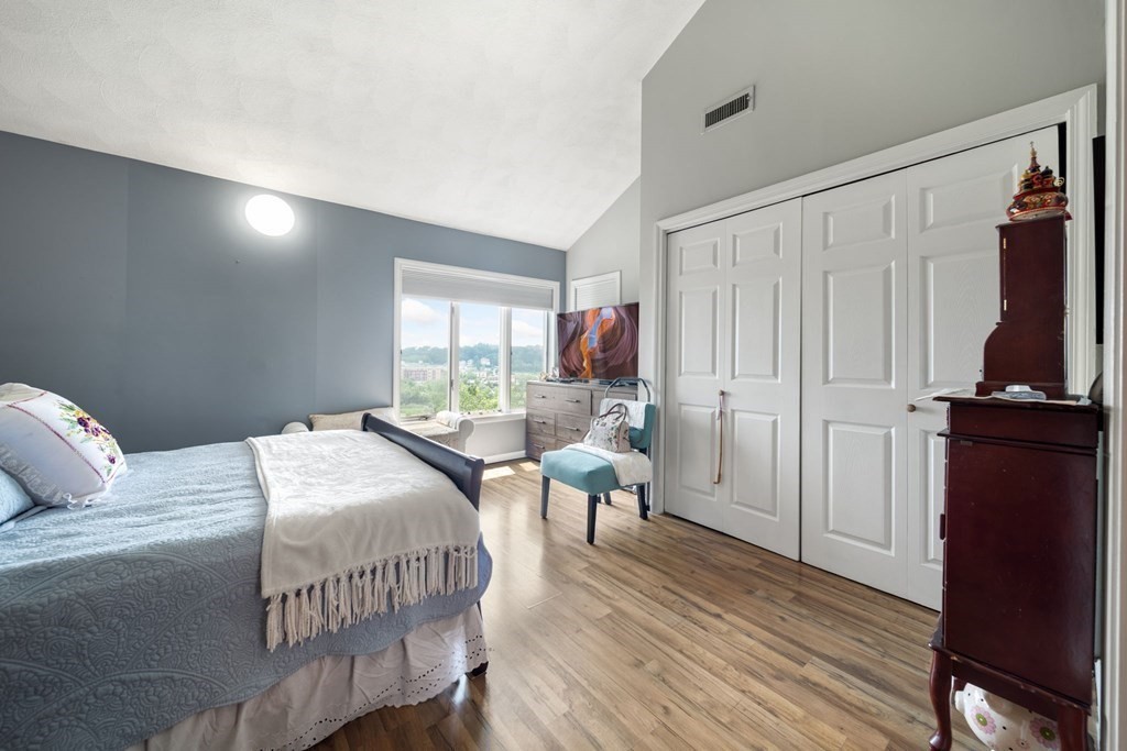 80 Ridge Road, Unit 80 Revere, MA 02151 - Photo 26 of 41 a bedroom with a bed and a table in it