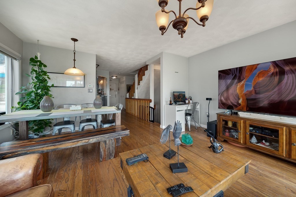 80 Ridge Road, Unit 80 Revere, MA 02151 - Photo 3 of 41 a living room with furniture and a fireplace