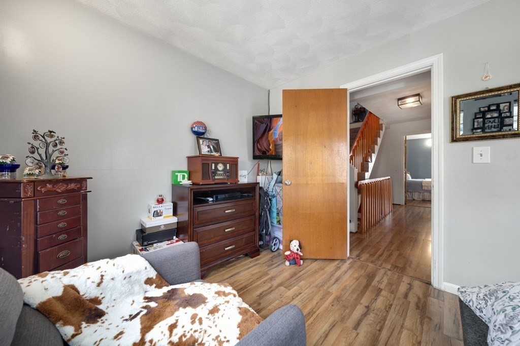 80 Ridge Road, Unit 80 Revere, MA 02151 - Photo 33 of 41 a bed room with a bed and a dresser