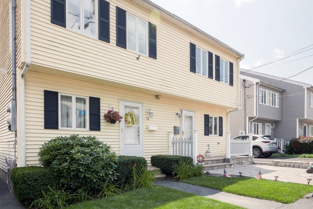 80 Ridge Road, Unit 80 Revere, MA 02151 - Photo 40 of 41 a view of a white house with large windows and plants