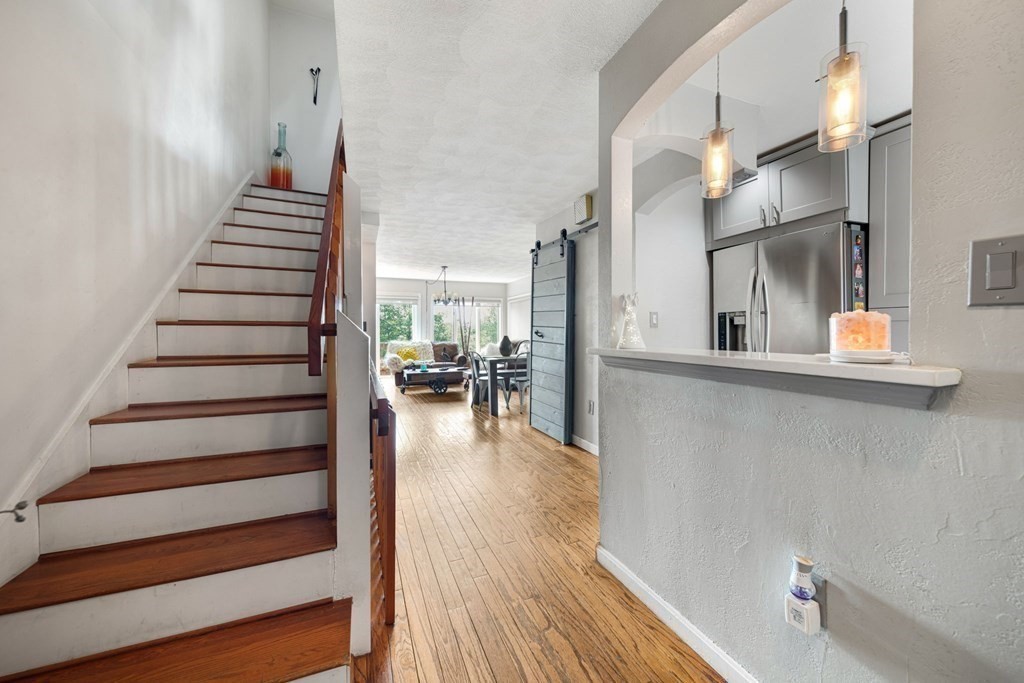 80 Ridge Road, Unit 80 Revere, MA 02151 - Photo 5 of 41 a view of entryway and hall with wooden floor
