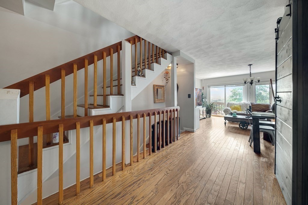 80 Ridge Road, Unit 80 Revere, MA 02151 - Photo 6 of 41 a view of living room with wooden floor and windows