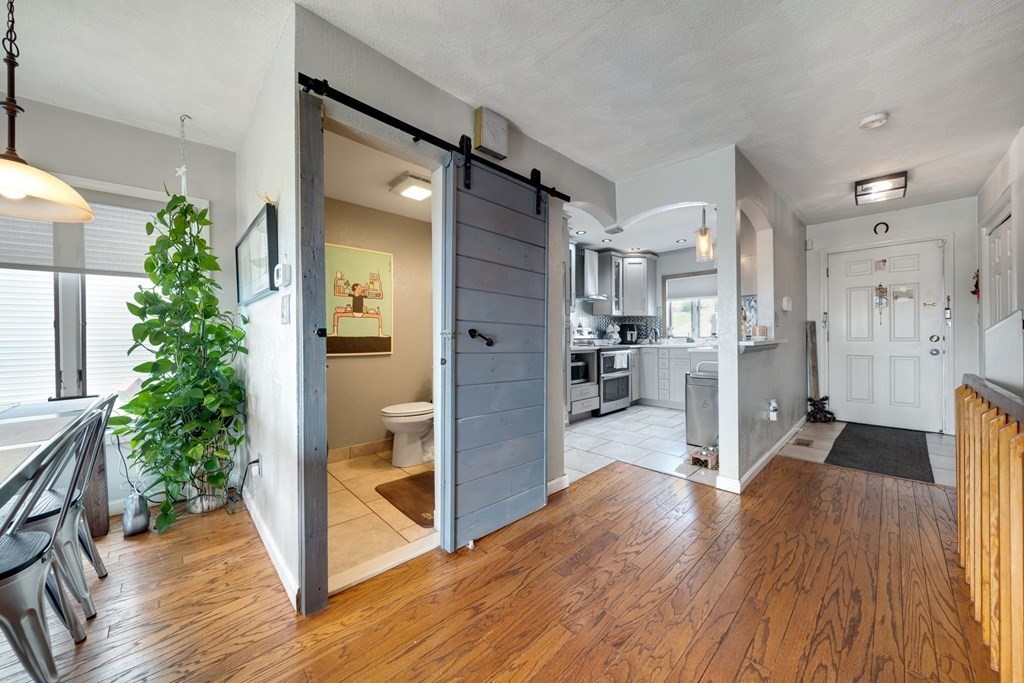 80 Ridge Road, Unit 80 Revere, MA 02151 - Photo 7 of 41 a view of a hallway view with wooden floor and a living room