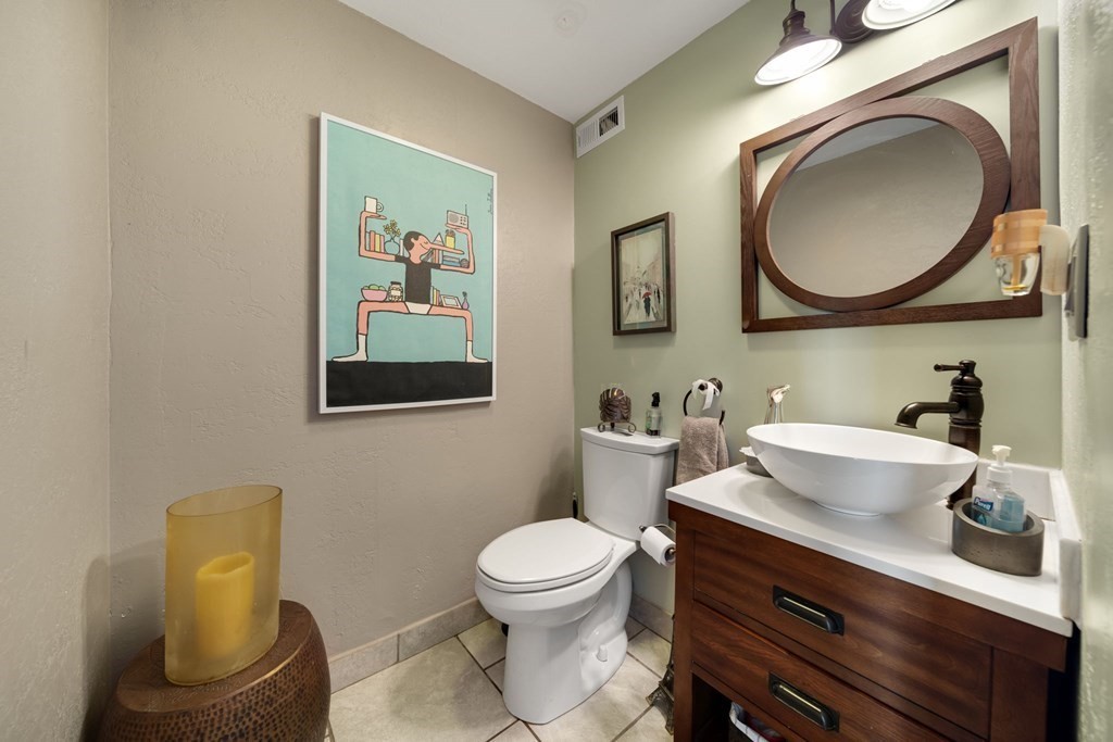 80 Ridge Road, Unit 80 Revere, MA 02151 - Photo 8 of 41 a bathroom with a toilet a sink and mirror