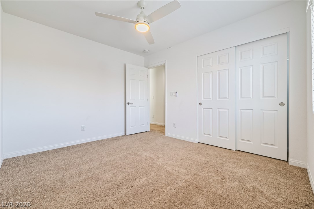 5510 Ripple Ridge Avenue Las Vegas, NV 89139 - Photo 34 of 45 This airy bedroom offers a comfortable retreat with a neutral palette and ample space.