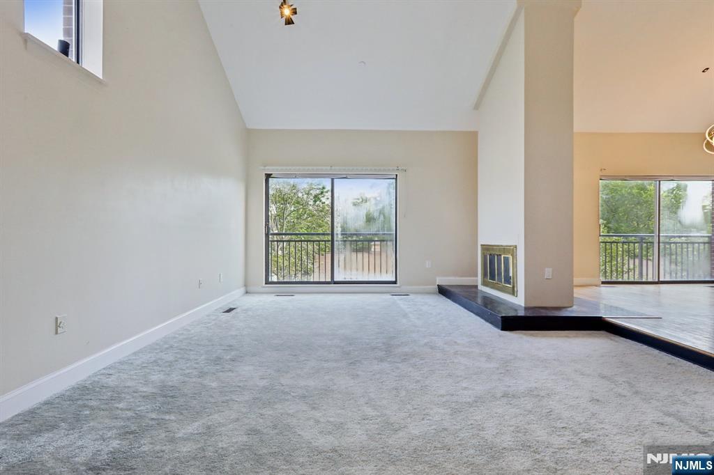 5 Millay Court Teaneck, NJ 07666 - Photo 11 of 36 an empty room with windows