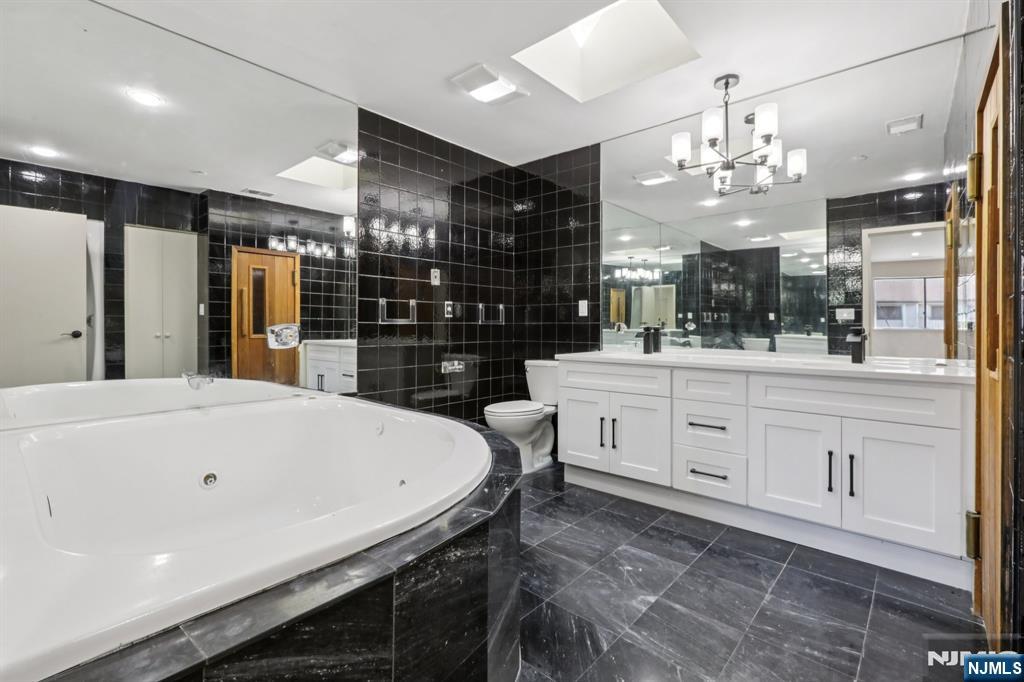 5 Millay Court Teaneck, NJ 07666 - Photo 20 of 36 a kitchen with a counter space cabinets and appliances