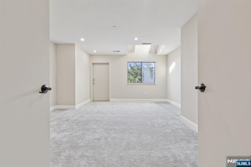 5 Millay Court Teaneck, NJ 07666 - Photo 23 of 36 a view of an empty room with a window