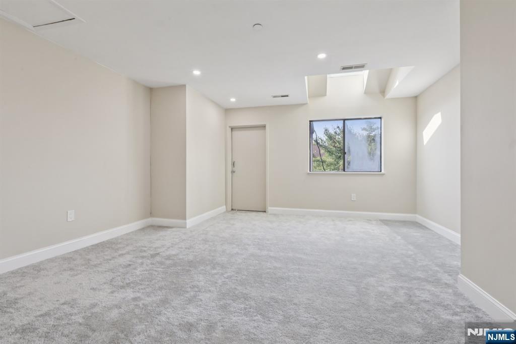 5 Millay Court Teaneck, NJ 07666 - Photo 24 of 36 an empty room with windows and closet