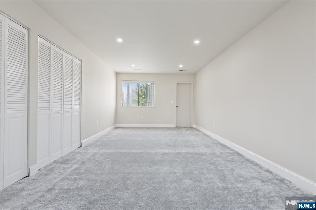 5 Millay Court Teaneck, NJ 07666 - Photo 26 of 36 an empty room with windows