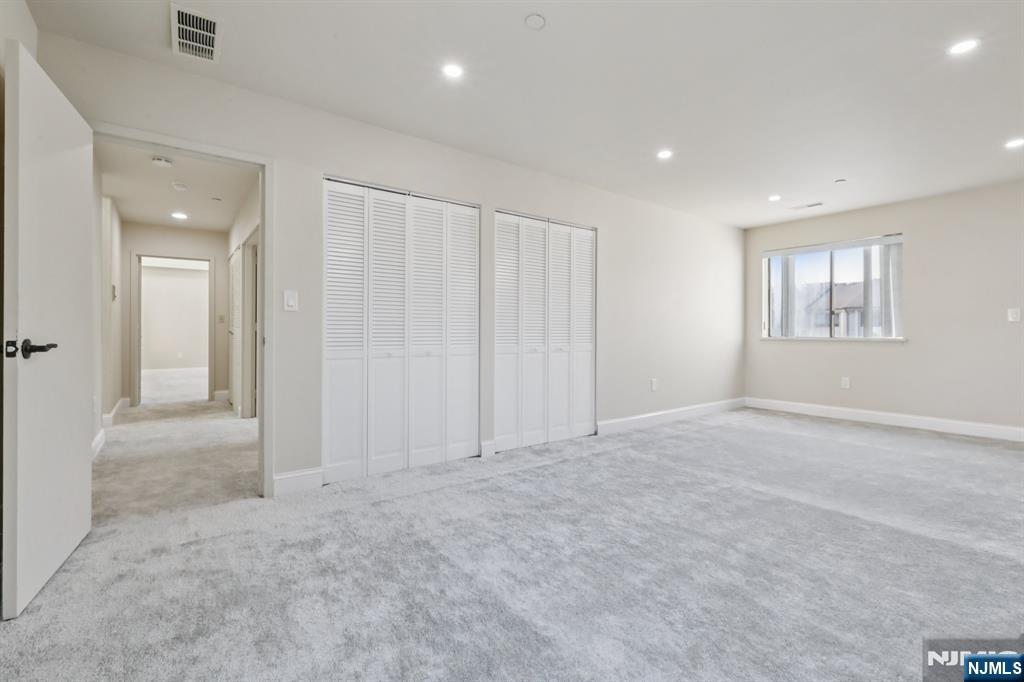 5 Millay Court Teaneck, NJ 07666 - Photo 27 of 36 an empty room with windows and closet