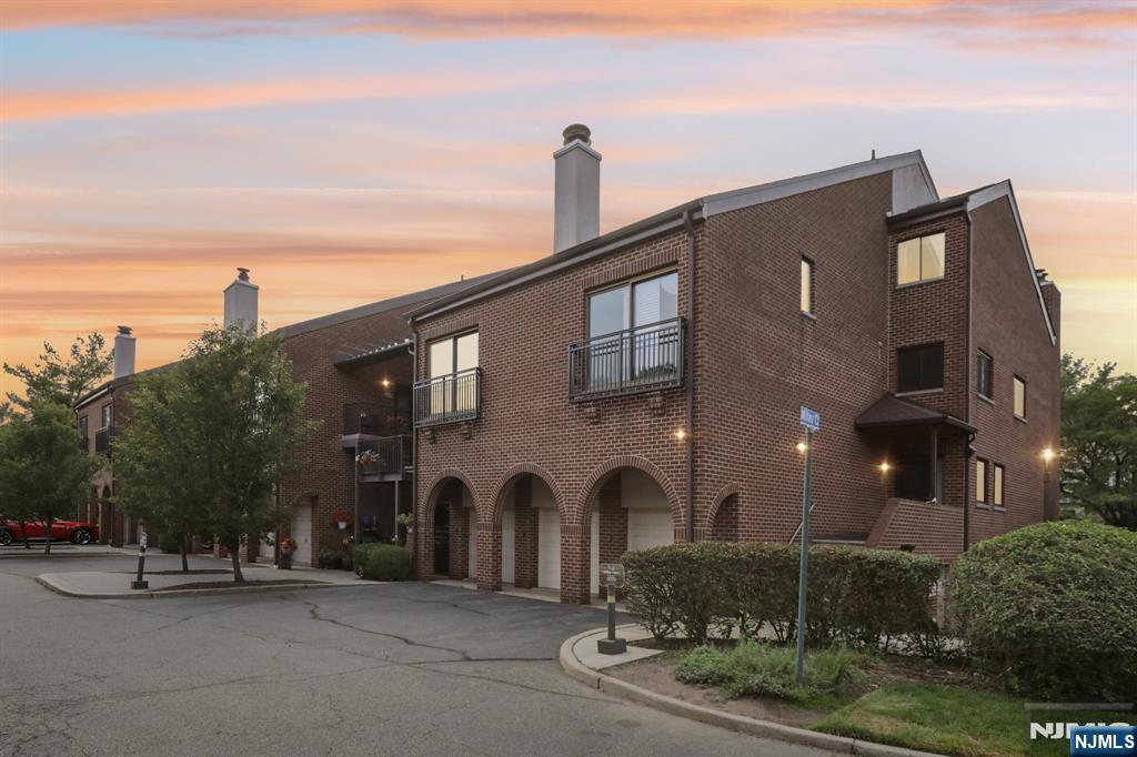 5 Millay Court Teaneck, NJ 07666 - Photo 33 of 36 a front view of a building with trees