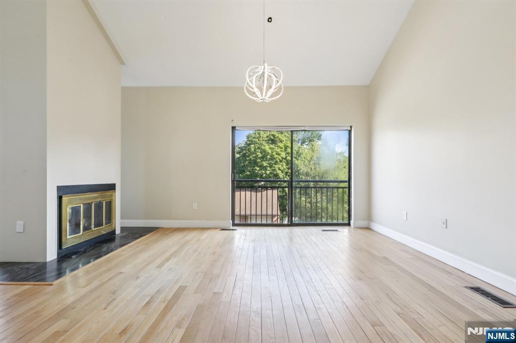 5 Millay Court Teaneck, NJ 07666 - Photo 8 of 36 a view of a livingroom with wooden floor