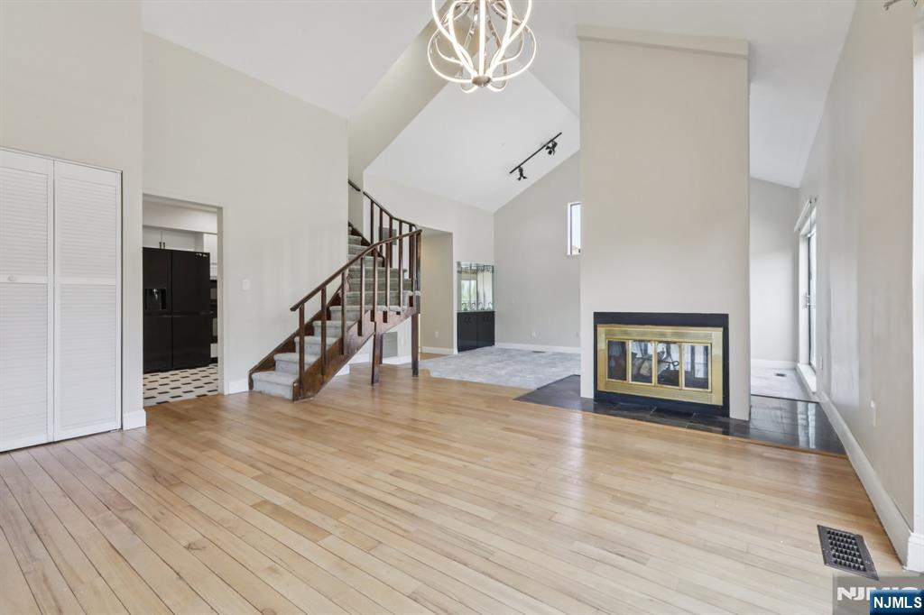 5 Millay Court Teaneck, NJ 07666 - Photo 9 of 36 a view of an entryway with wooden floor